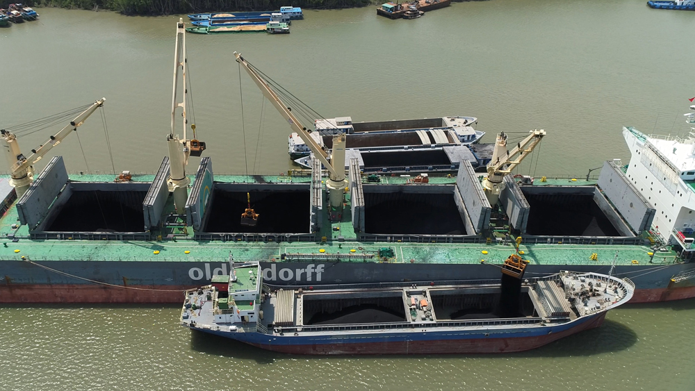 Stevedore working on vessel GERTRUDE OLDENDORFF for discharging coal Discharging Coal