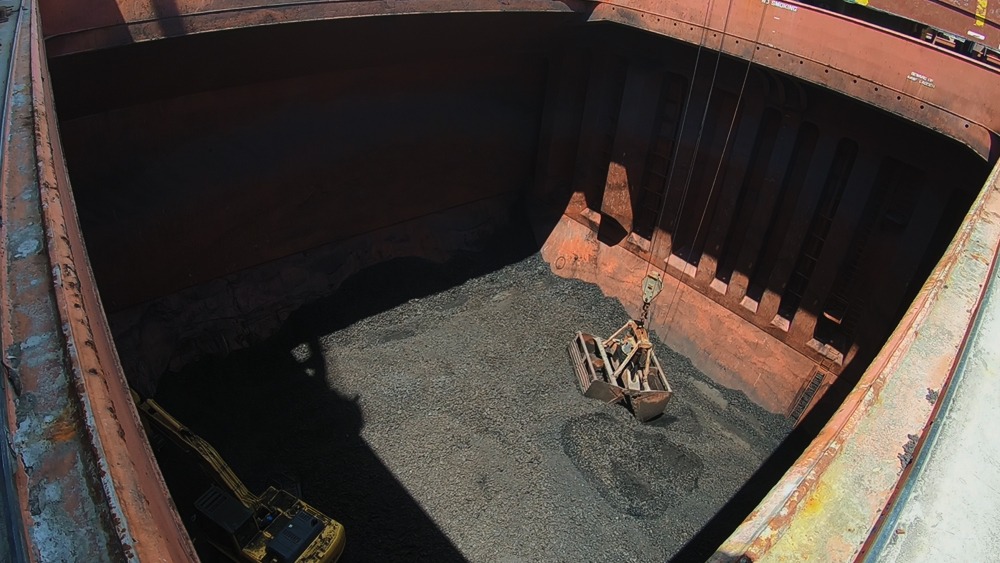 Stevedore working on vessel GERTRUDE OLDENDORFF for discharging coal Discharging Coal
