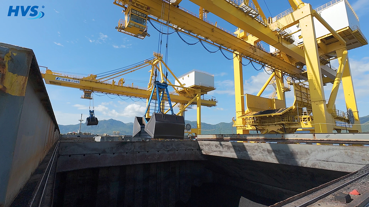 Stevedore working on vessel GERTRUDE OLDENDORFF for discharging coal Deploy the crane system to transfer coal from the mother vessel to the conveyor belt on the pier